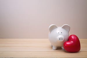 Piggy bank with red heart
