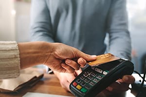 Person processing a card payment at a card processor